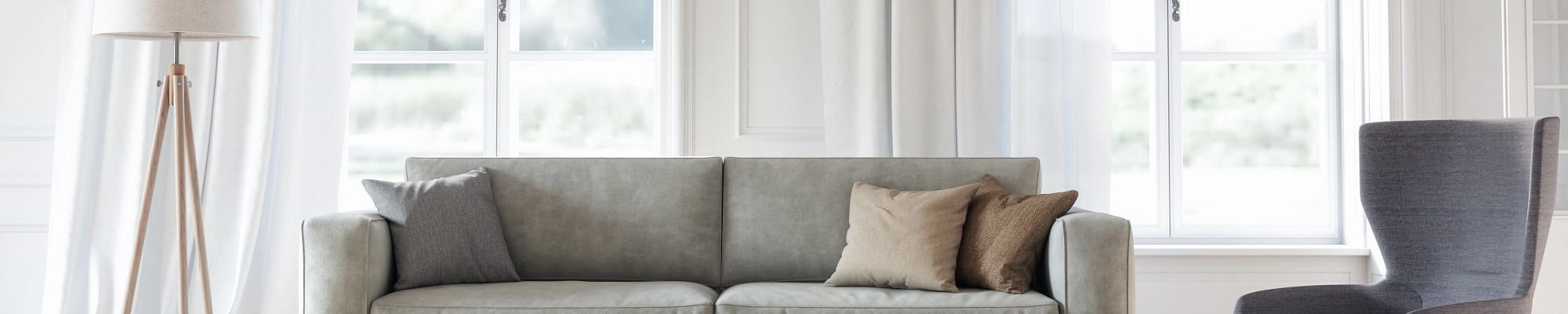 Bright living room with a gray couch - Capitol Carpet in Dalton, GA